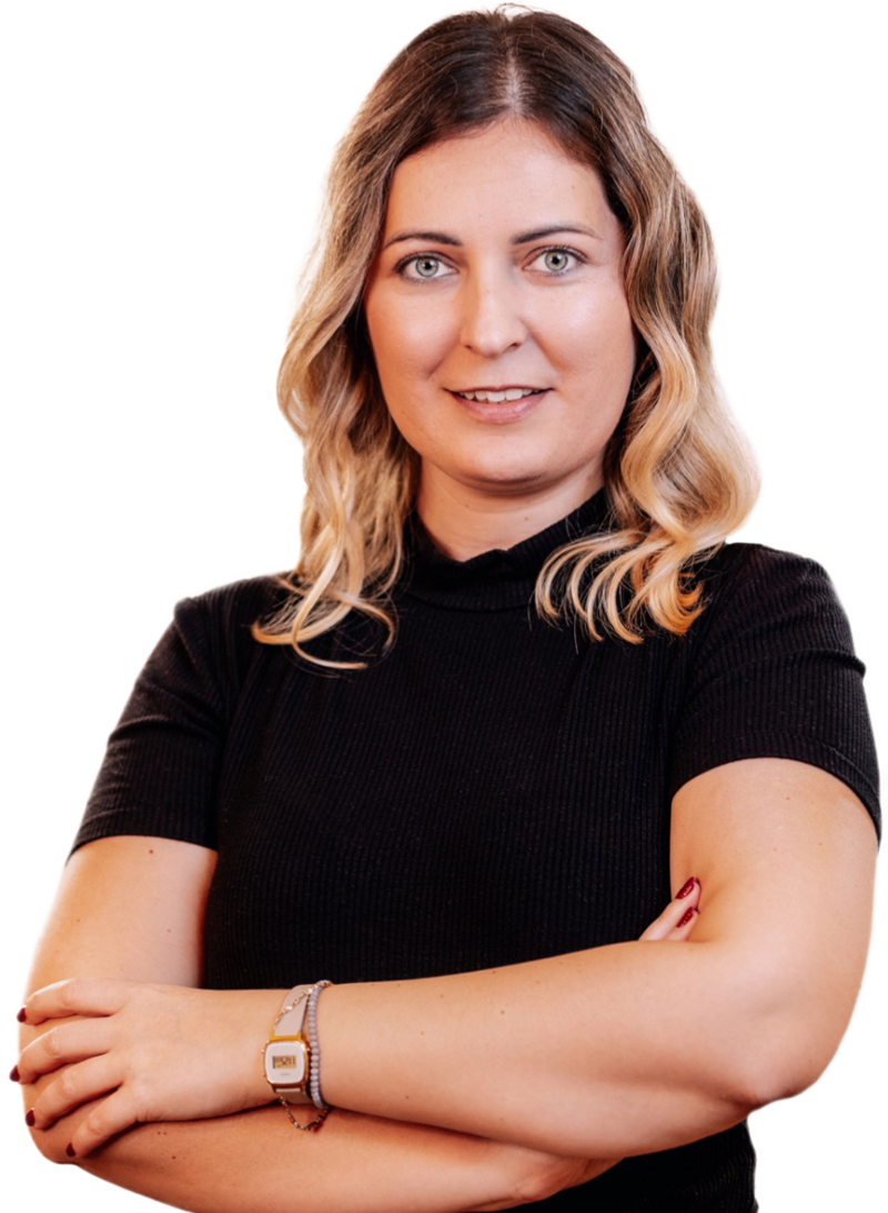 Smiling female incorporation specialist with long blonde hair and crossed arms.